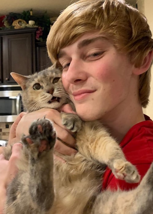 Logan Thirtyacre with his pet cat, as seen in March 2019