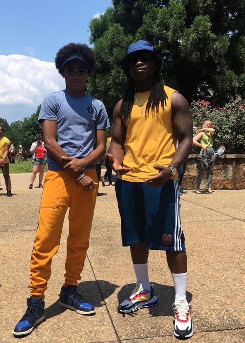 Quincy Fouse (Left) as seen while posing for a picture alongside Chris Lee in 2019