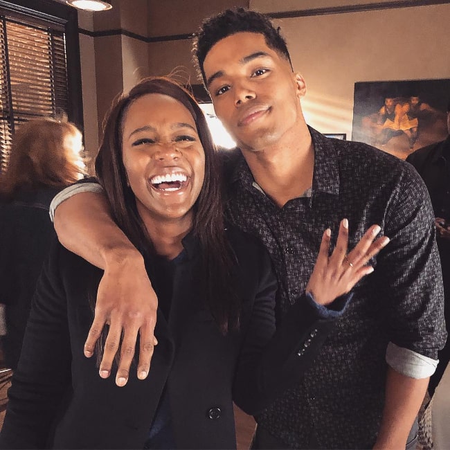 Rome Flynn as seen while posing for a picture alongside Aja Naomi King in February 2019