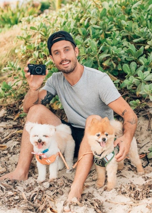 Sawyer Hartman with his pet dogs, as seen in August 2019