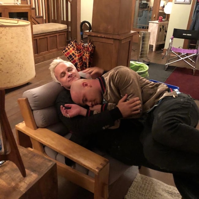 Actor David Anders hugging Bryce Hodgson while he lay on him on the set of iZombie in October 2018