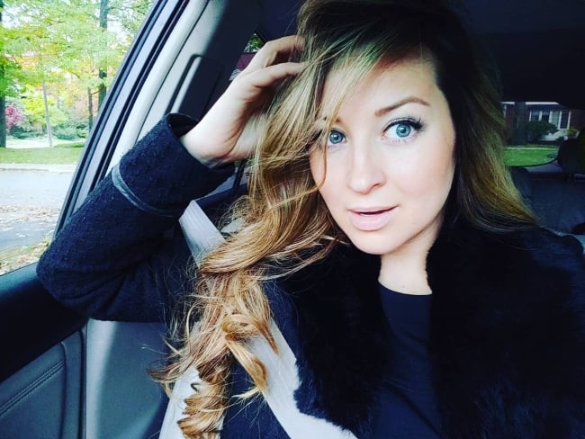 Ashley Leggat as seen while clicking a car selfie in October 2018