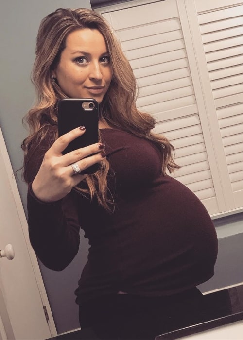 Ashley Leggat as seen while taking a mirror selfie showing her baby bump in May 2019