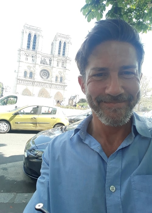 Christien Anholt as seen while smiling for a selfie in Paris, France in April 2018