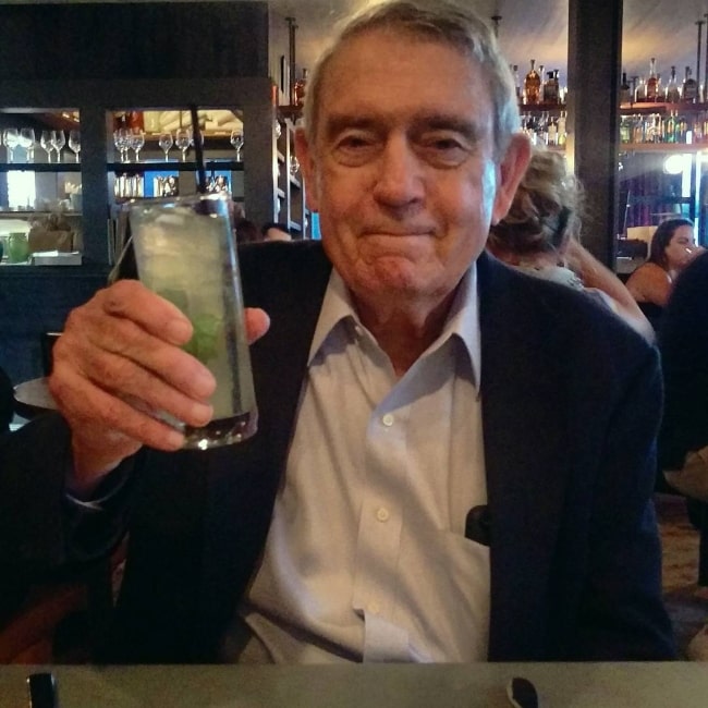 Dan Rather enjoying a drink before an interview in June 2017