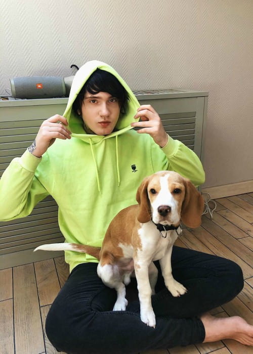 Denis Stoff with his dog as seen in March 2020