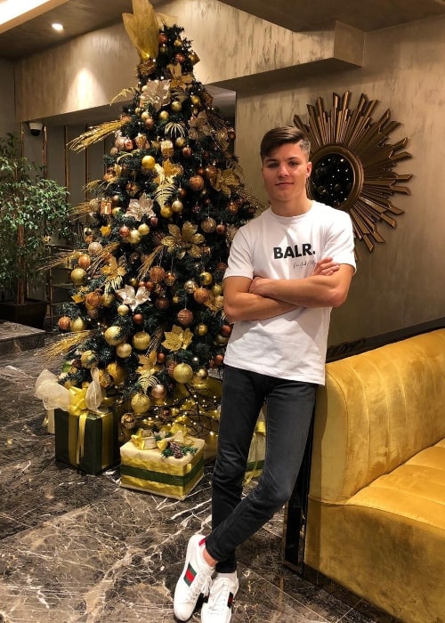Lirim Zendeli posing for a Christmas picture in December 2019