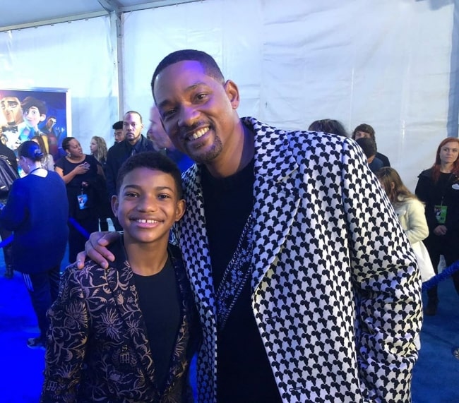 Lonnie Chavis (Left) as seen while smiling for a picture alongside Will Smith at the El Capitan Theatre in December 2019