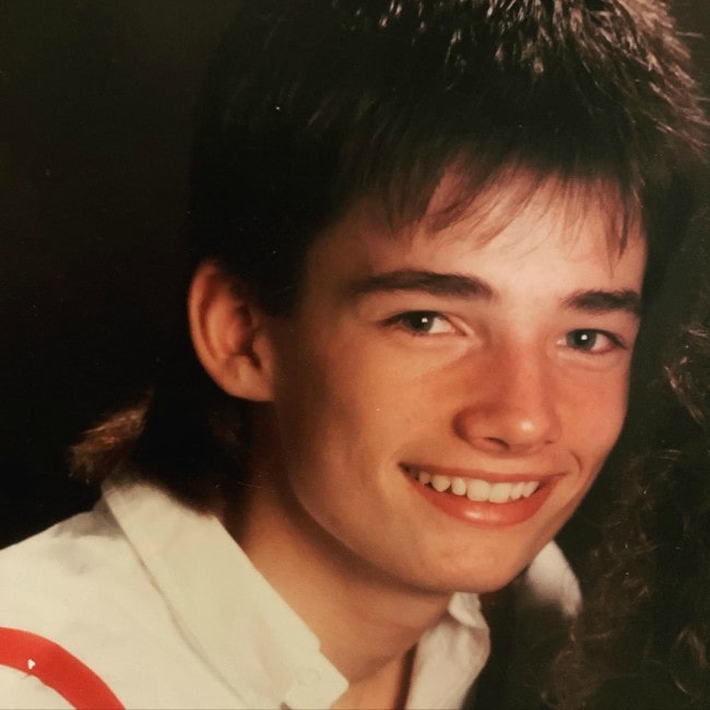 Warren Christie as seen while smiling in a picture from his younger days