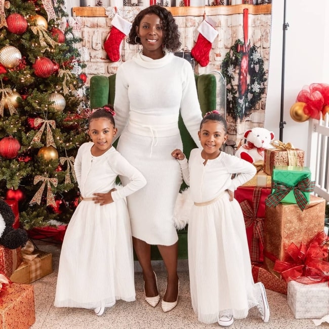 Ami McClure as seen in a picture taken with her daughters Ava and Alexis in December 2019