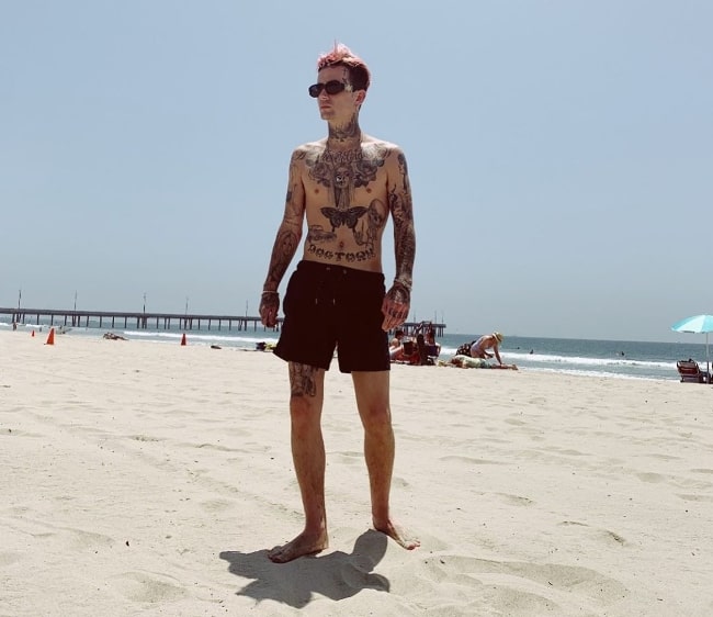 Austin Wilson as seen while posing shirtless for a picture at a beach