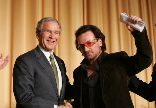 Bono (Right) and then-U.S. President George W. Bush shaking hands in 2006