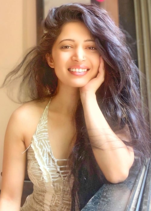 Charlie Chauhan as seen while smiling for a picture in June 2020