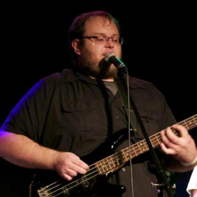 Gary Brolsma as seen in a picture while playing the bass guitar during a concert