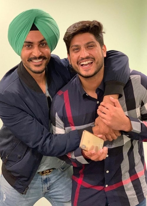 Gurnam Bhullar (Right) smiling in a picture alongside Rajvir Jawanda