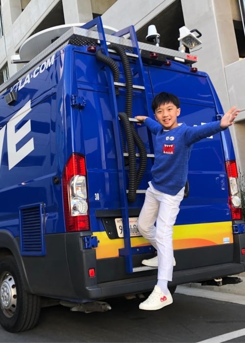 Ian Chen in a picture taken while hanging of the ladder of a 5 Live van in March 2019