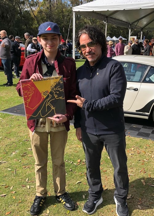 John Oates with a young fan, as seen in March 2020