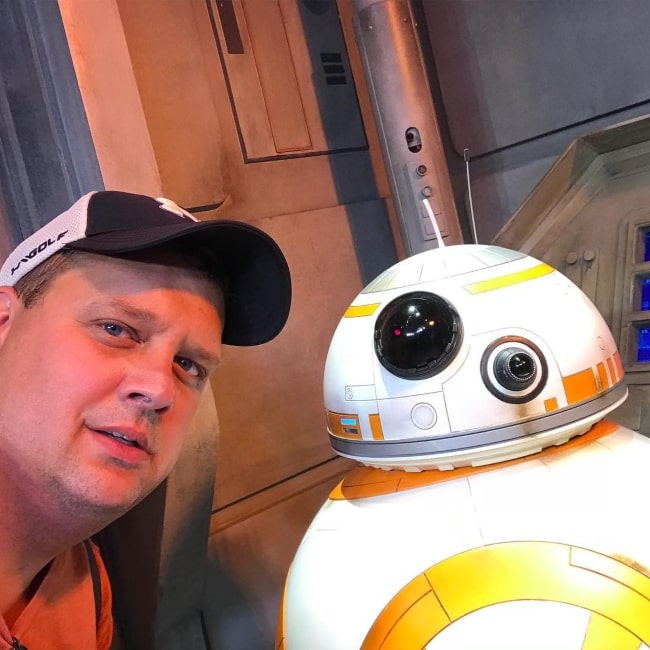 Ken Reese posing with Star Wars character BB-8 in July 2018