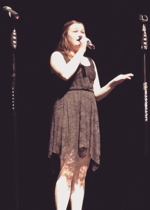 Kyla Rae Kowalewski in a picture taken while she sang the song Hey, Soul Sister by Train during a high school performance in January 2018