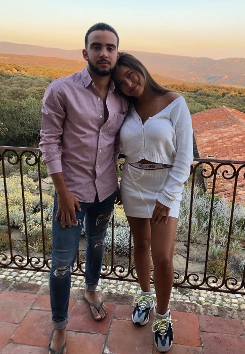 Lola Grace Consuelos smiling for a picture alongside Tarek Fahmy in June 2019