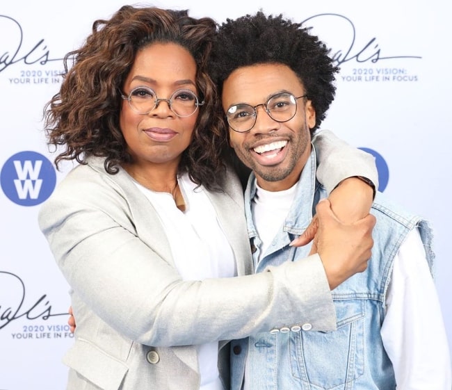 Luke Youngblood smiling in a picture alongside Oprah Winfrey in Los Angeles, California, United States