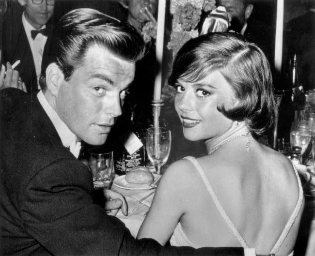 Natalie Wood smiling for a picture alongside husband Robert Wagner at the Academy Awards dinner in 1960