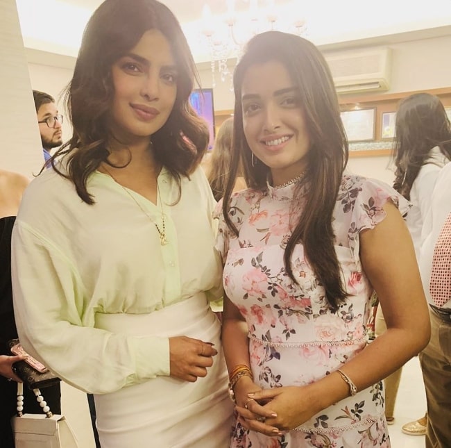 Amrapali Dubey (Right) as seen while smiling in a picture alongside Priyanka Chopra