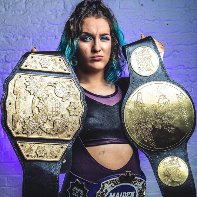 Dani Luna as seen in a picture taken with proudly holding her 3 titles in April 2020