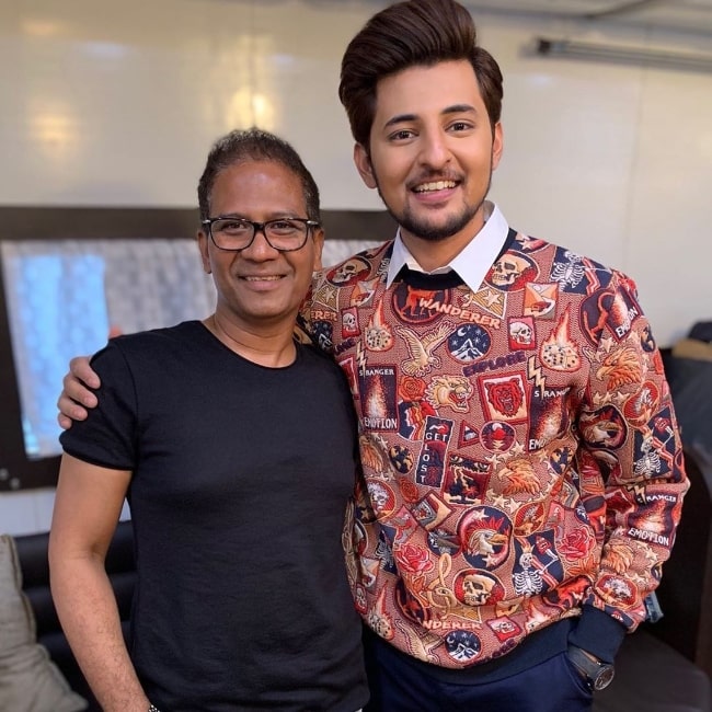 Darshan Raval smiling in a picture alongside Naushad Bhramer