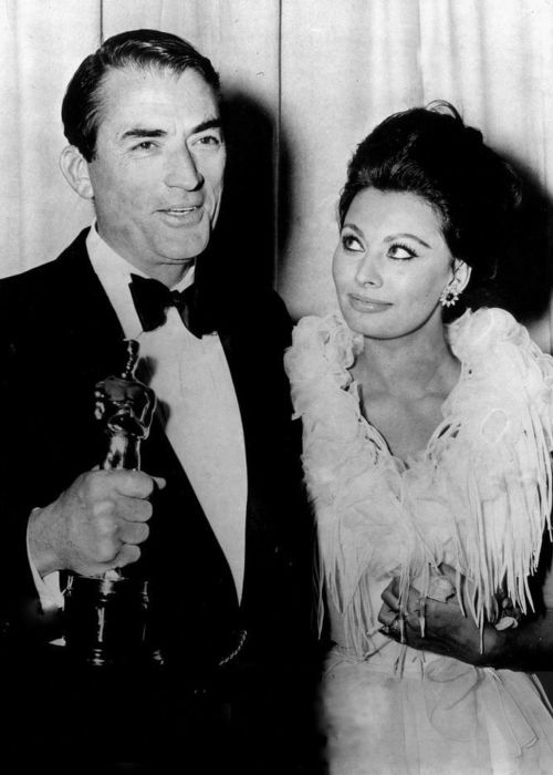 Gregory Peck as seen with Sophia Loren at the Academy Awards in 1963