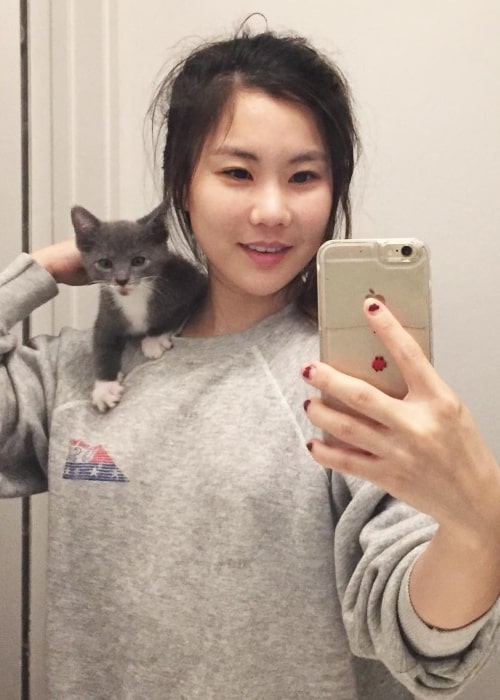 Irene Choi having a great time with a kitten in June 2017