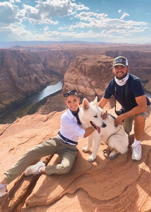 Melody Le as seen in a picture that was taken with her dog Gstaad and husband Christiaan in August 2020, at the Horseshoe Bend in Arizona