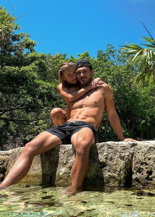 Michael Yerger posing for the camera along with Daisy Keech in Tulum, Mexico in June 2020