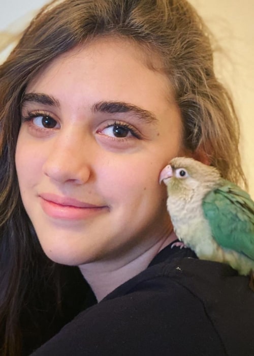 Rachel CraftyGirls as seen in a picture taken with her bird Indigo in March 2020