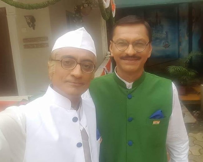 Shyam Pathak (Right) smiling in a selfie alongside Amit Bhatt