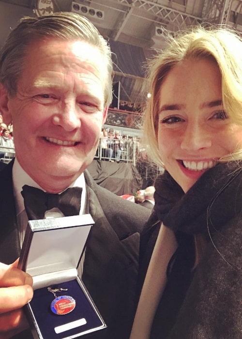 Sophie Colquhoun smiling in a selfie along with her father at London Olympia as he got presented the Medal of Honour for his services to the British