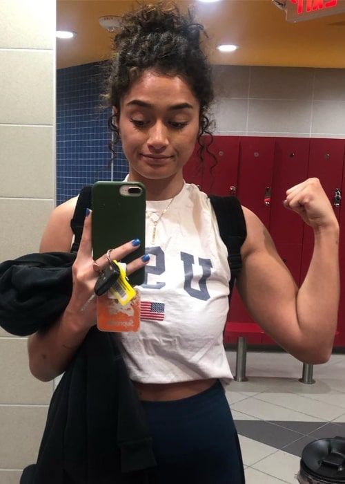 Tina Woods as seen while showing her bicep in a mirror selfie in June 2019