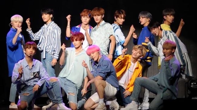 Vernon and his bandmates seen performing the song Oh My! in 2018