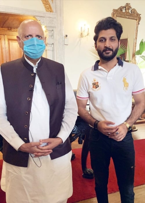 Bilal Saeed (Right) as seen while posing for a picture alongside the 33rd Governor of Punjab Chaudhry Mohammad Sarwar at Governor's House in Lahore, Punjab, Pakistan in July 2020