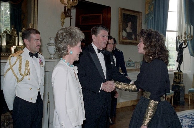 Jaclyn Smith greeting President Ronald Reagan and First Lady Nancy Reagan at a Reception for Major Contributors and Entertainers for The 1986 Ford'S Theater Festival Gala in The Blue Room in June 1986