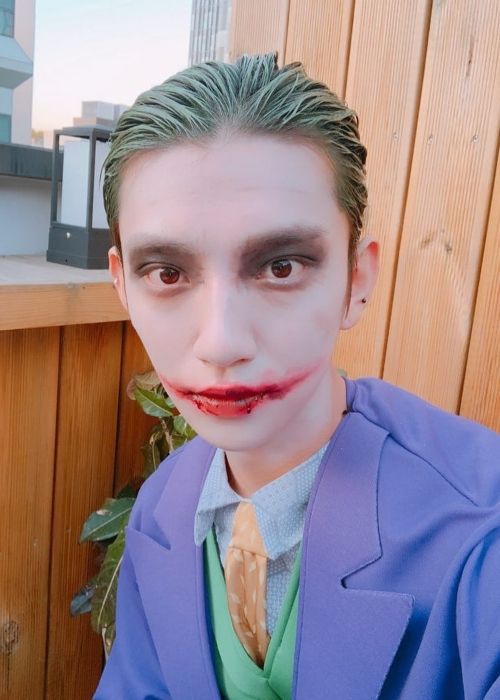 Joshua taking a selfie dressed as the Joker on Halloween in 2018