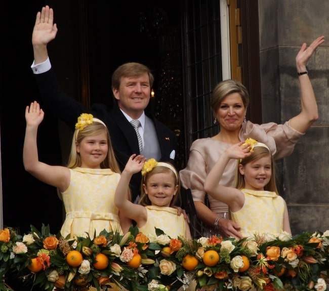 King Willem-Alexander, Queen Maxima, and Princesses Catharina-Amalia, Alexia, and Ariane pictured during the balcony scene after the abdication of Beatrix in May 2013
