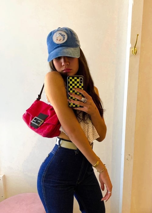 Meg DeLacy in April 2019 flaunting the cap she bought