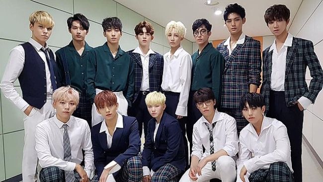 Members of Seventeen as seen posing together in 2017