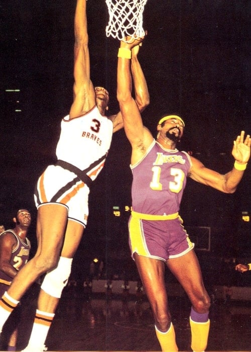 Wilt Chamberlain (Right) and Elmore Smith during a basketball game circa 1971