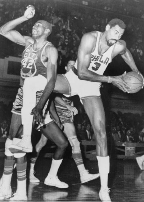 Wilt Chamberlain (Right) and Nate Thurmond pictured during a basketball game in 1966