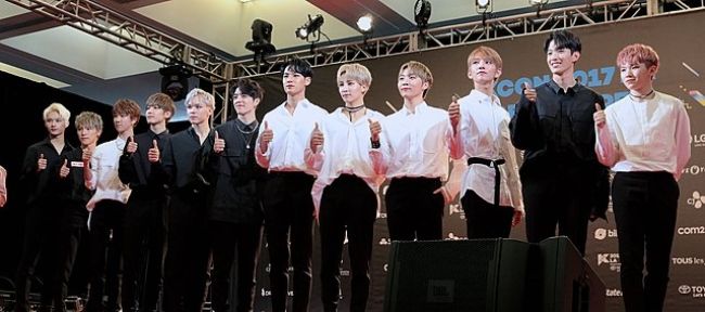 Woozi (extreme right) seen with his Seventeen bandmates at the 2017 KCON in LA