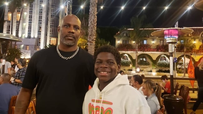 Artyon Celestine (Right) as seen while smiling for a picture alongside rapper DMX in August 2020