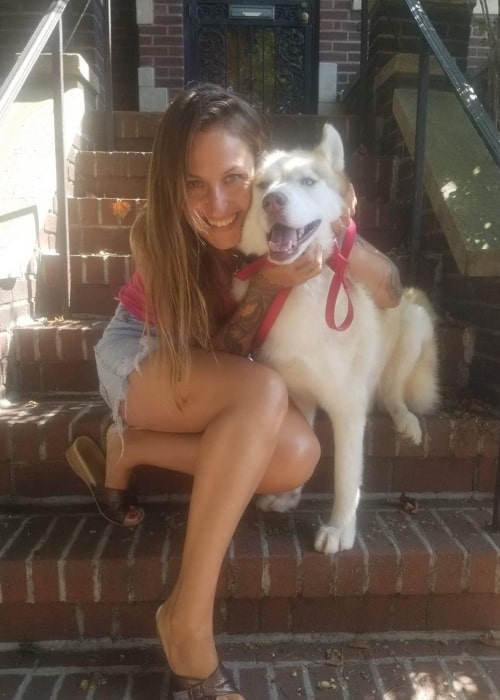 Domino Kirke as seen in a picture with her dog named Lobo in August 2019