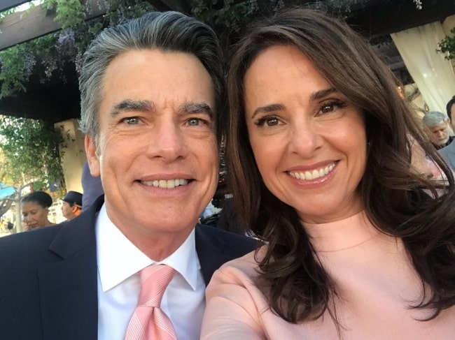 Jacqueline Obradors smiling in a selfie alongside Peter Gallagher in February 2019